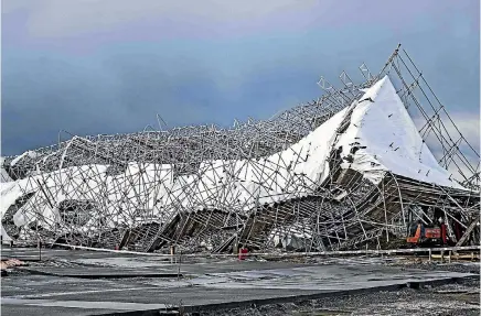  ?? PHOTO: LAWRENCE SMITH/STUFF ?? The spectacula­r collapse of scaffoldin­g at a building site was among the widespread damage in Auckland caused by a storm.