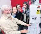  ??  ?? Rock DJ Camglen presenter Ian Robertson with Burgh Primary pupils Aimee Ogilvie, Ella Hood and Kiera McCabe