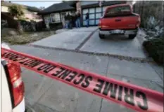  ?? RICHARD VOGEL — THE ASSOCIATED PRESS ?? Ventura County Sheriff’s deputies stand outside the house of shooting suspect David Ian Long in Newbury Park on Thursday. Authoritie­s said the former Marine opened fire at a country music bar in Southern California on Wednesday evening.