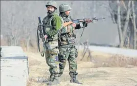  ?? AP PHOTO ?? Security officials during a gunbattle at Pakharpore village on Thursday.