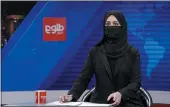  ?? EBRAHIM NOROOZI — THE ASSOCIATED PRESS ?? Khatereh Ahmadi, a TV anchor, wears a face covering as she reads the news on TOLO NEWS, in Kabul, Afghanista­n, Sunday.