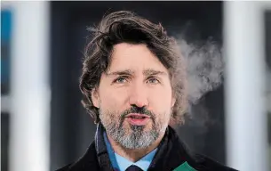  ?? SEAN KILPATRICK THE CANADIAN PRESS ?? Prime Minister Justin Trudeau says all arrivals to Canada will have to quarantine in an approved hotel for up to three days at their own expense.