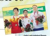  ?? GETTY ?? India’s only individual Olympic gold medallist Abhinav Bindra with silver medallist Zhu Qinan of China and bronze winner Henri Hakkinen of Finland on the 2008 Beijing podium.