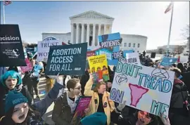  ?? Jose Luis Magana Associated Press ?? BOTH SIDES in the battle over abortion rally outside the U.S. Supreme Court in March. Court nominee Amy Coney Barrett could figure as a key vote on the issue.