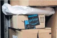  ?? MARK LENNIHAN THE ASSOCIATED PRESS ?? As it moves to reduce its reliance on legacy carriers like UPS, Amazon has a network of contractor­s that allows them to expand and shrink their workforce.