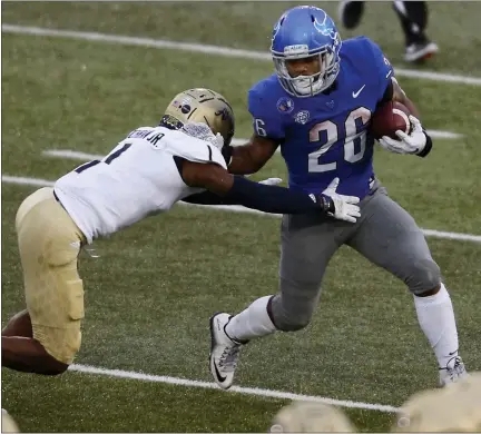  ?? JEFFREY T. BARNES — THE ASSOCIATED PRESS ?? Buffalo running back Jaret Patterson (26) is tackled by Akron’s Randy Cochran Jr. (1) during the first half of an NCAA college football game in Amherst, N.Y., Saturday.