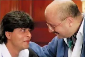  ??  ?? Above: The scene from DDLJ which was inspired by Kher’s interactio­n with his own father. Left: Kher with Woody Allen