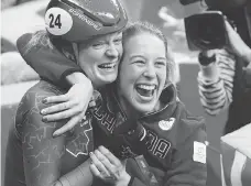  ??  ?? Kim Boutin, left, celebrates her bronze in women’s 500-metre short track with Marianne St-Gelais. PAUL CHIASSON/THE CANADIAN PRESS