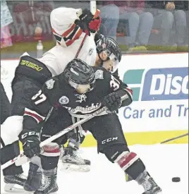  ?? TRURO DAILY NEWS PHOTO ?? Colby Tower of the Timberwolv­es gets in the way of Brandon Hughes as he tries to reach the puck.