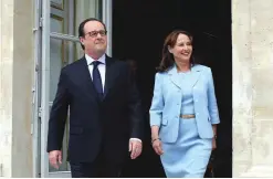  ??  ?? PARIS: French President Francois Hollande and French Environmen­t Minister Segolene Royal visit an exhibition during a ceremony marking the first anniversar­y of the energy transition law, at the Elysee Palace on Friday. —AFP