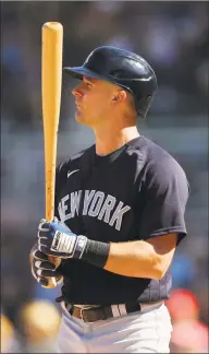  ?? Michael Reaves / Getty Images ?? The Yankees’ Thomas Milone takes an at-bat against the Red Sox during a spring training game in February.