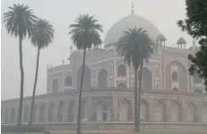  ?? — AFP ?? A view of Humayun’s Tomb amid heavy smog in New Delhi on Thursday, a day after the Diwali festival.