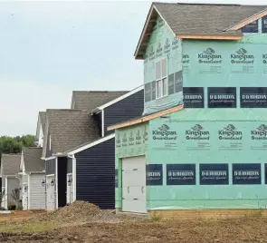  ?? SARA C. TOBIAS/THE ADVOCATE ?? Homes in various stages of constructi­on on Ephraim Drive, just north of Ohio 16 in Pataskala. The city's population increased 19.5% in the last decade, to 17,886 residents.