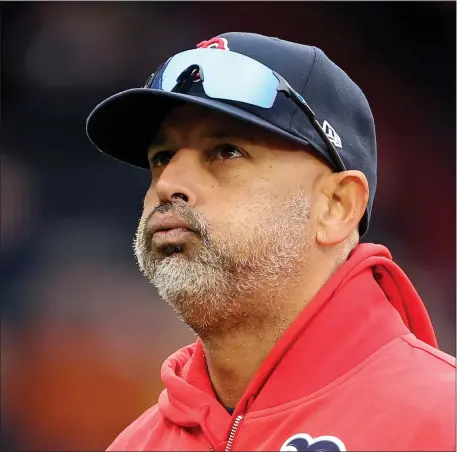  ?? MATT STONE — BOSTON HERALD ?? Red Sox manager Alex Cora walks back to the dugout during the fifth inning of the MLB game against the Cleveland Guardians at Fenway Park.