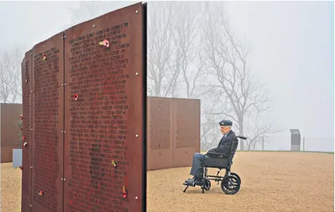  ??  ?? Geoffrey Towers, 93, from Pontefract, a former Halifax rear gunner, at the Internatio­nal Bomber Command Centre’s Wall of Names