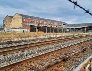  ?? NICK GRAHAM / STAFF ?? The former Beckett Paper Co. plant is expected to become a mixed-use developmen­t with residentia­l and retail tenants. Some officials say it’s a great location for an Amtrak platform that would accommodat­e the proposed 3C+D passenger rail line in Hamilton.