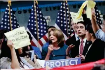  ?? LEA SUZUKI /SAN FRANCISCO CHRONICLE VIA AP ?? U.S. HOUSE MINORITY LEADER NANCY PELOSI tries to talk as protesters demonstrat­e during a press conference on the DREAM ACT on Monday in San Francisco.