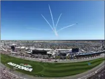  ?? BRIAN LAWDERMILK, GETTY IMAGES ?? The Air Force Thunderbir­ds perform a flyover prior to the 59th annual Daytona 500 at Daytona Internatio­nal Speedway.