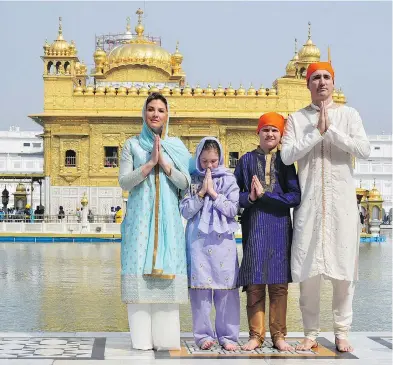  ?? PUBLIC RELATIONS OFFICE GOVT. OF PUNJAB VIA AP ?? Canadian Prime Minister Justin Trudeau, his wife Sophie Grégoire Trudeau, their daughter Ella Grace, second left, and son Xavier greet in Indian style during their visit to the Golden Temple, in Amritsar, India, last week.