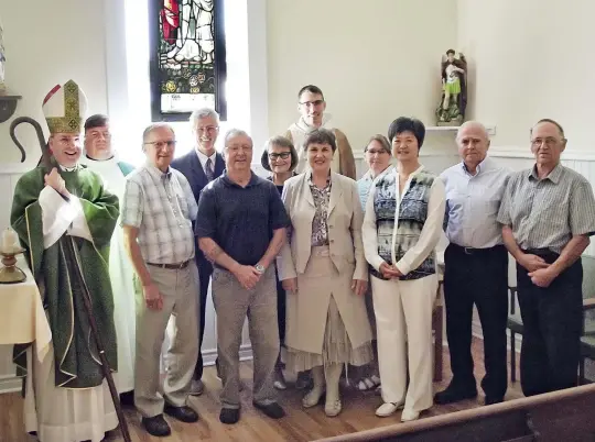  ??  ?? Above (from left), 1st row: Bishop Michael Mulhall, Keith Nadeau, Carl Nadeau, Carole Morin, Kathleen Wong, Lynus Adam, Brother François Giguère. 2nd row: Father Réal Ouellette, Peter Gervais, Mireille Gervais, Deacon Justin Bertrand, Suzette Adam. Top...