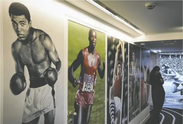  ?? PHOTOS: LAURENT CIPRIANI / AP PHOTO ?? Photos of Muhammad Ali, left, Carl Lewis, centre, and Sergei Bubka are displayed at the Paris exhibit on Wednesday.