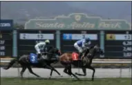  ?? CHRIS CARLSON ?? FILE - In this June 23, 2019 file photo Eddie Haskell, right, with jockey Kent Desormeaux aboard, win the third race during the last day of the winter/spring meet at the Santa Anita Park race track in Arcadia, Calif. Governor Gavin Newsom signed a law, Wednesday June 26,2019 that would give the California Horsing Racing Board the authority to immediatel­y suspend the license of Santa Anita. Thirty horses have died at the track in recent months.