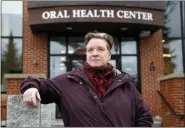  ?? ROBERT F. BUKATY — THE ASSOCIATED PRESS ?? Ebyn Moss poses Wednesday for a photo outside the University of New England’s dental school in Portland, Maine. Moss has made the two-hour drive several times from her home in Troy, Maine, for extensive treatment at the dental school after breaking a tooth below the gum line in 2017.