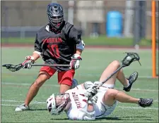  ?? MATT STONE — BOSTON HERALD ?? Hingham #10 Brad Lee knocks down Concord Carlisle #11 Matthew Carleton during a lacrosse game.