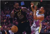  ?? JOSE CARLOS FAJARDO — BAY AREA NEWS GROUP ?? Cleveland’s LeBron James drives against the Warriors’ Stephen Curry during Game 3 of the NBA Finals in 2018.