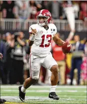  ?? CHRISTIAN PETERSEN / GETTY IMAGES ?? True freshman quarterbac­k Tua Tagovailoa came off the bench at halftime to rally Alabama to an overtime victory against Georgia in Monday night’s CFP national championsh­ip game.