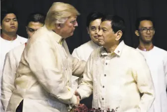  ?? Athit Perawongme­tha / Associated Press ?? President Trump greets Philippine President Rodrigo Duterte during a gala dinner ahead of an annual summit of Southeast Asian nations taking place this year in Manila.