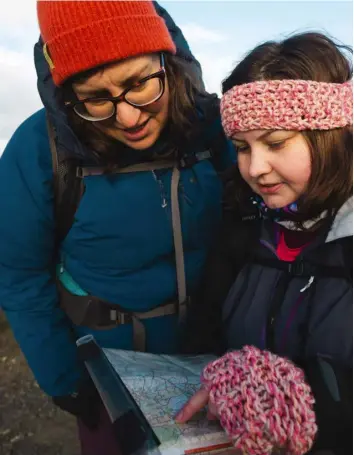  ?? ?? ABOVE LEFT Making new like-minded friends is one of the many bonuses of joining EBO
ABOVE Writer Steph (left) helps volunteer Sarah Hindley plan the route