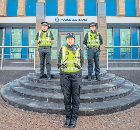  ??  ?? FRONT LINE: Sergeant Lucy Cameron and fellow officers at the Tayside HQ in Dundee. Picture by Steve MacDougall.