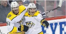  ?? KEVIN KING ?? Nashville Predators forward Ryan Hartman, right, scored the game-winning goal against the Winnipeg Jets late in the third period in his debut with his new club, giving the Predators a 6-5 victory in Winnipeg.