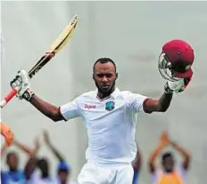  ?? AFP ?? Gritty knock West Indies batsman Jermaine Blackwood celebrates his century on day three of the first Test against England.