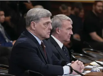  ?? J. SCOTT APPLEWHITE — THE ASSOCIATED PRESS ?? Retired Gen. Mark Milley, left, the former chairman of the Joint Chiefs of Staff, and retired Gen. Kenneth Mckenzie, the former commander of the U.S. Central Command, appear during a hearing before the House Foreign Affairs Committee at the Capitol in Washington on Tuesday about the U.S. withdrawal from Afghanista­n.