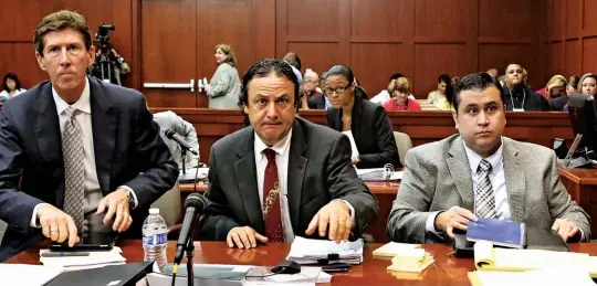  ??  ?? TRIAL BY FIRE Left to right, attorney Mark O’mara, Hirschhorn and Zimmerman at the 2013 trial for the shooting of Martin.