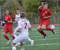  ?? STAN HUDY/THE SARATOGIAN ?? Mechanicvi­lle junior Nick Amodeo leaps up to kick the ball out of the defensive zone against Guilderlan­d as teammate Justin Pugliese (12) looks on Saturday morning in non-league action.