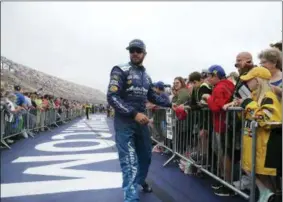  ?? CARLOS OSORIO — THE ASSOCIATED PRESS ?? Martin Truex Jr. greets fans during driver introducti­ons before a NASAR Cup Series race last Sunday in Brooklyn, Mich. Sonoma Raceway, Sonoma, California FS1 Radio SiriusXM NASCAR