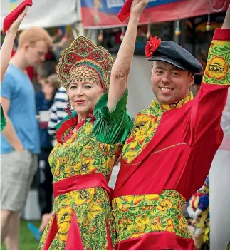  ?? PHOTO: MURRAY WILSON/ FAIRFAX NZ ?? Olga Rossiter and Slava Filitchev pose at the Festival of Cultures, Palmerston North, in 2016.