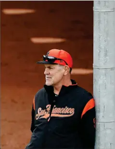  ?? MATT YORK ?? In this Feb. 13, photo, San Francisco Giants manager Bruce Bochy watches his team during a baseball spring training practice, in Scottsdale, Ariz.