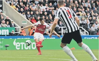  ??  ?? Granit Xhaka fires home Arsenal’s opener on Saturday.