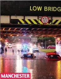  ??  ?? Cars trapped in one of yesterday’s flash floods MANCHESTER