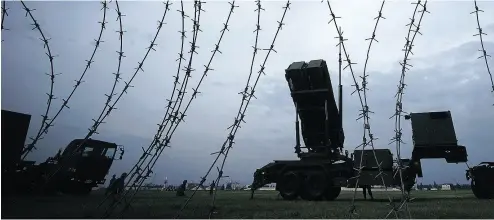  ?? EUGENE HOSHIKO / THE ASSOCIATED PRESS ?? The Japan Air Self-Defence Force demonstrat­es surface-to-air intercepto­rs at the U. S. Yokota Air Base near Tokyo.