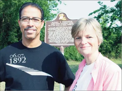  ?? Bill Haber / Associated Press file photo ?? Keith Plessy and Phoebe Ferguson, descendant­s of the principals in the Plessy V. Ferguson court case, in front of a historical marker in New Orleans in 2011. Homer Plessy, the namesake of the U.S. Supreme Court’s 1896 “separate but equal” ruling, is being considered for a posthumous pardon. The Creole man of color died with a conviction still on his record for refusing to leave a whites-only train car in New Orleans in 1892.