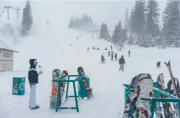  ?? BRENDAN HOFFMAN/THE NEW YORK TIMES ?? The ski resort last month in Dragobrat, Ukraine. Ukrainians have flocked to ski resorts nestled in the Carpathian Mountains, largely spared the worst of the war with Russia, for a respite.