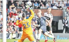  ??  ?? Manchester City’s Argentinia­n striker Sergio Aguero (2nd R) shoots over Fulham’s Spanish goalkeeper Sergio Rico to score their second goal during the English Premier League football match between Fulham and Manchester City at Craven Cottage in London on March 30, 2019. - AFP photo