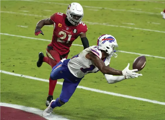  ?? AP File ?? ‘IN THE RIGHT PLACE’: Bills receiver Stefon Diggs hauls in a touchdown catch against the Cardinals on Nov. 15 to give Buffalo the lead.