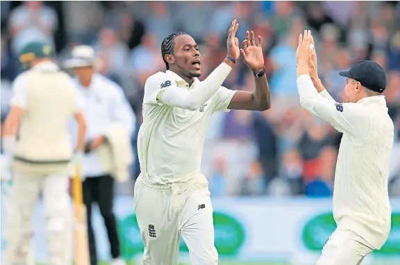  ?? Picture: PA. ?? Man-of-the-moment Jofra Archer celebrates taking the wicket of Australia’s David Warner at Headingley.