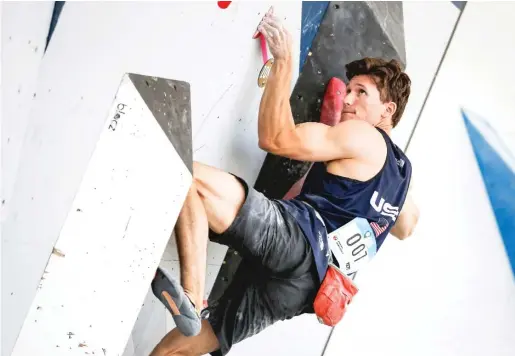  ?? ANDY BAO/GETTY IMAGES ?? “The hands are our main tool,” says U.S. Olympic climber Nathaniel Coleman, seen here during the bouldering qualificat­ions of the IFSC Climbing World Cup on May 29 in Salt Lake City, Utah.